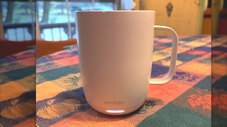 White electronic Ember mug on fall tablecloth