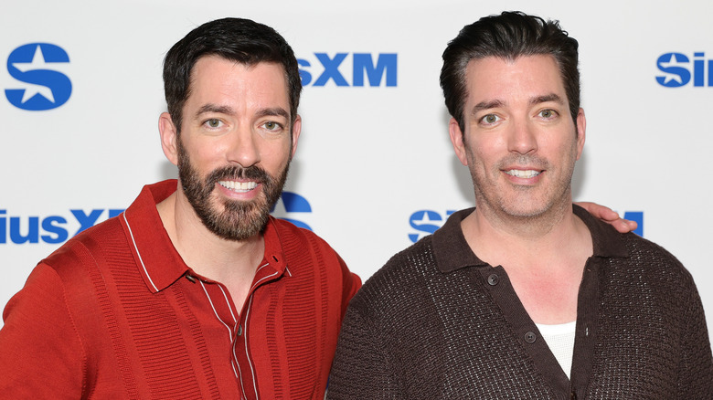Jonathan Scott and Drew Scott attend a red carpet event.