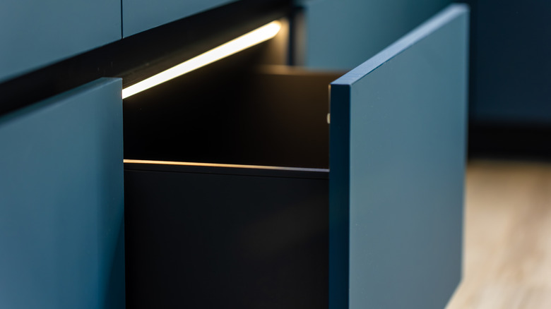 An opened kitchen drawer.