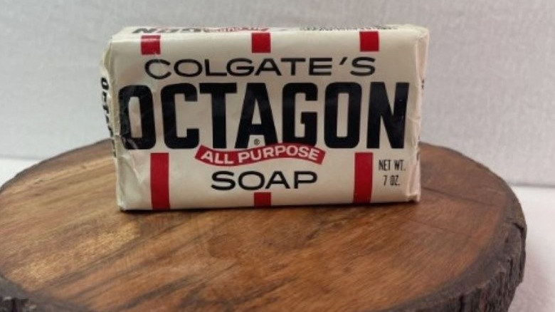 Octagon Soap sitting on a piece of wood