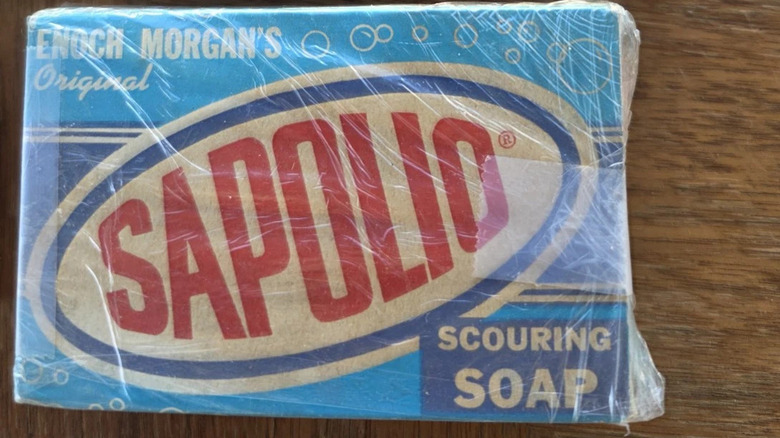 Sapolio scouring soap in packaging, on a wooden surface
