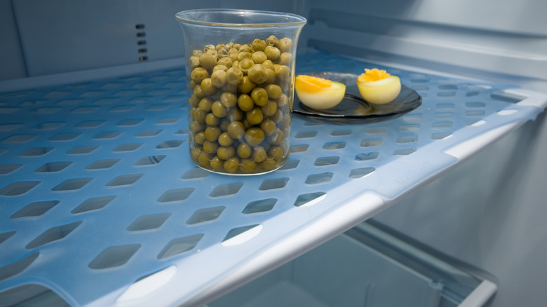 Blue shelf liner on a refrigerator shelf