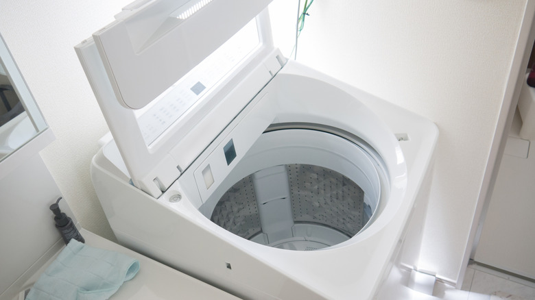 open top loading washing machine in home