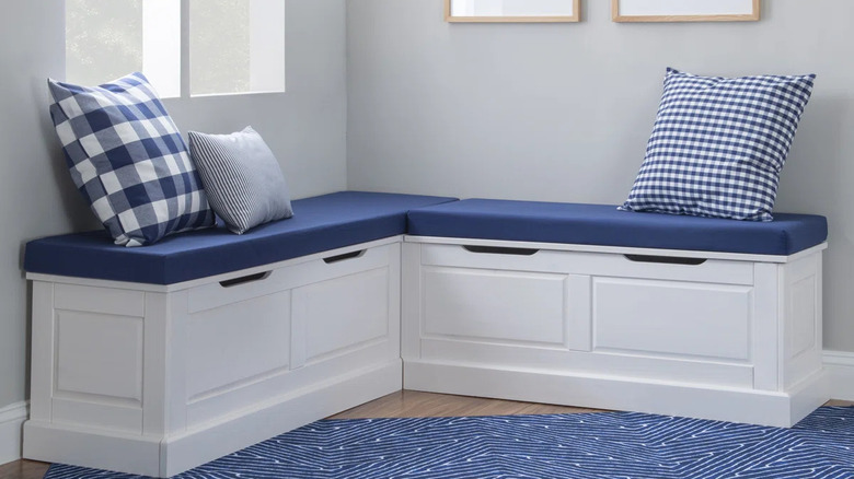 White banquette with blue and white cushion