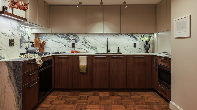 Kitchen with deep wood cabinets