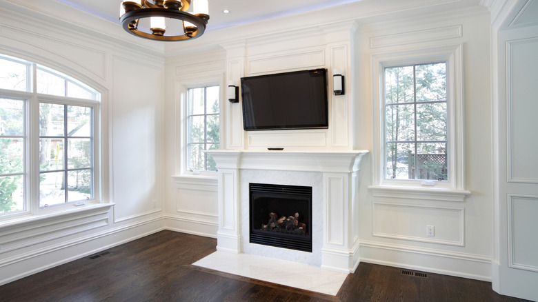 New home with the TV mounted above the fireplace