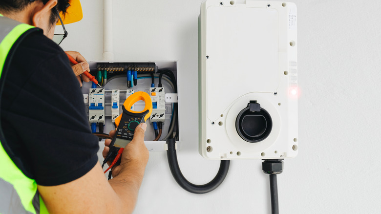 Professional checking home EV charger