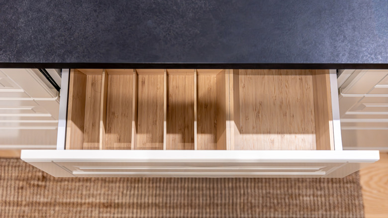 Top view of a pull-out drawer, organized with internal dividers