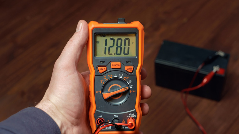 Person using multimeter