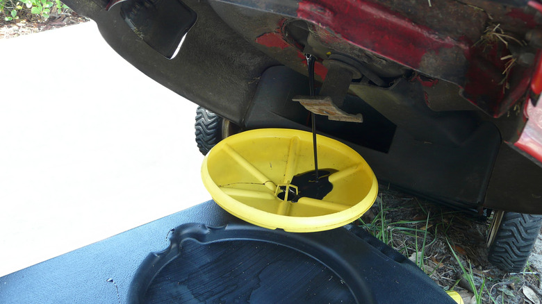 Draining oil from lawn mower