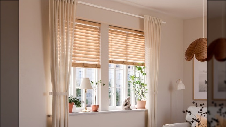 IKEA's LENDA Curtains on a window with plants in a living room