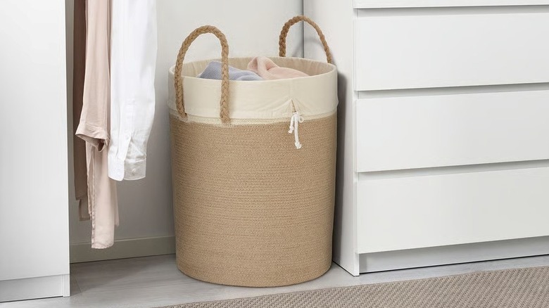 A jute LJUNGAN Laundry bag next to a dresser