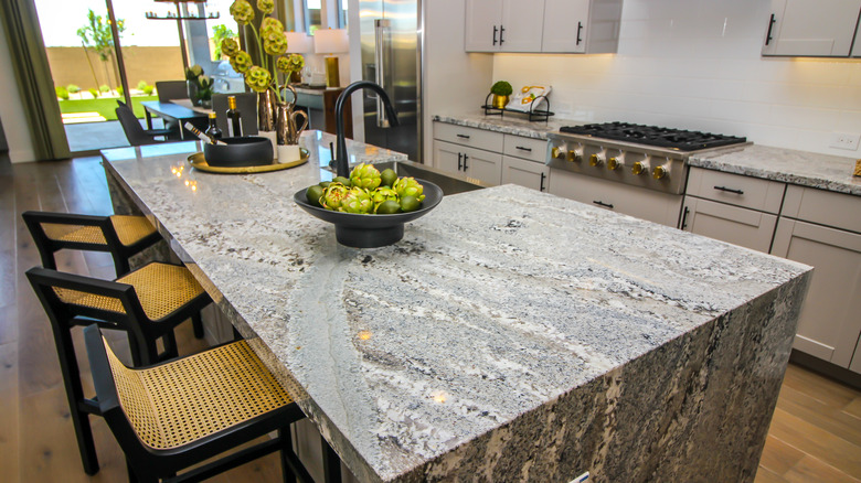 Beautiful kitchen island with grey granite countertops