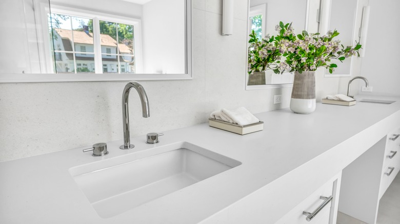 Large bathroom vanity with white quartz counters