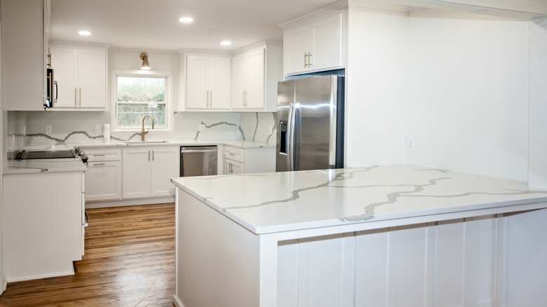All white kitchen with dramatic white countertops