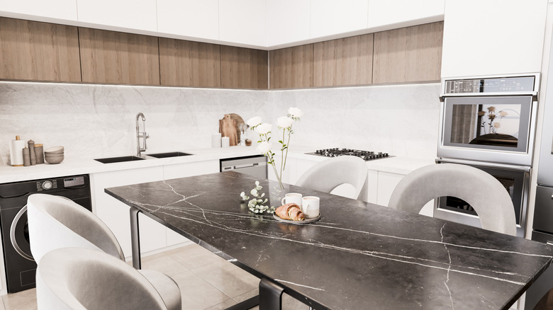 Modern kitchen with black marble island