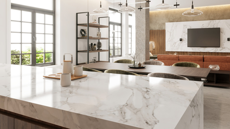 Large kitchen island with beautiful white marble counters