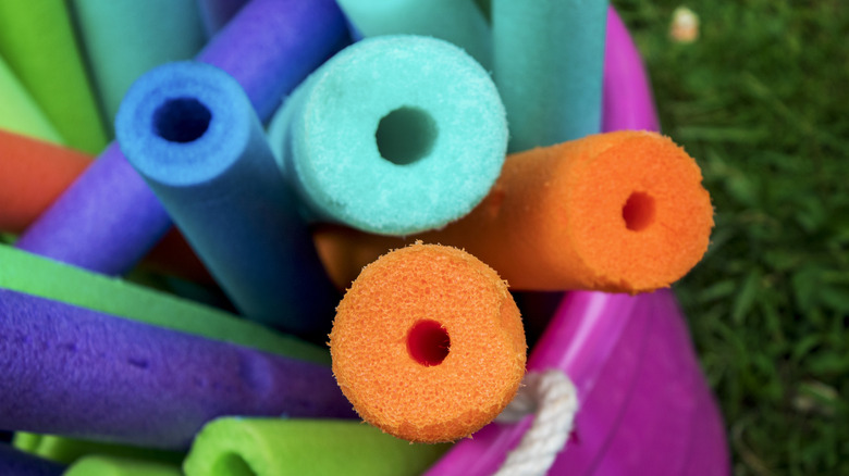 Bucket of foam pool noodles