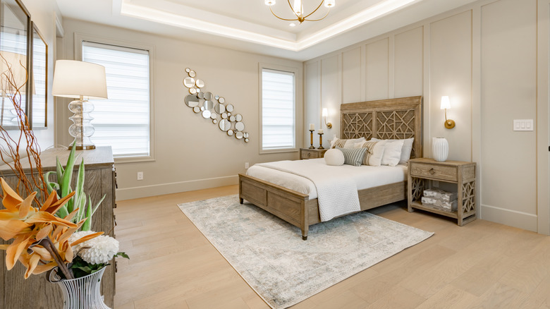 Area rug placed under the end of a bed