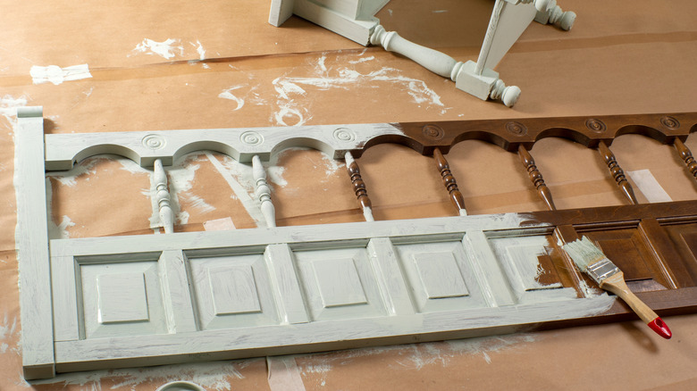 Partially painted wooden headboard