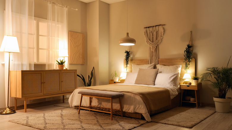 Bedroom with warm lighting and glowing lamps