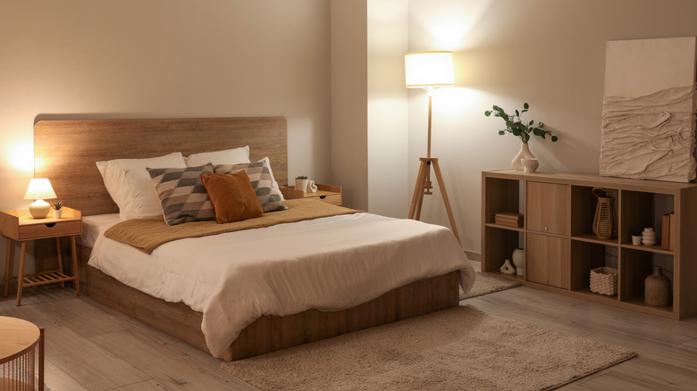 Bedroom with warm lighting and white and beige decor