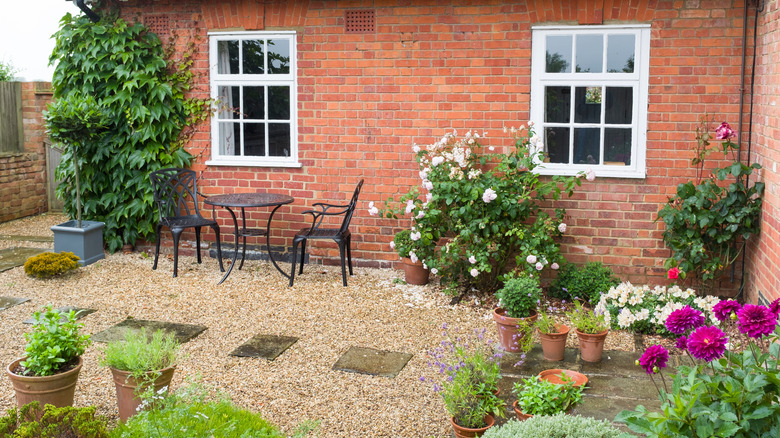 Small gravel patio with bristro table and chairs