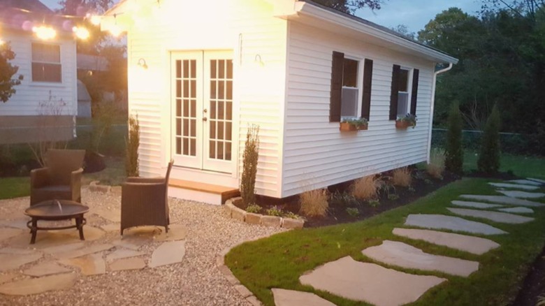Shed with gravel patio in front