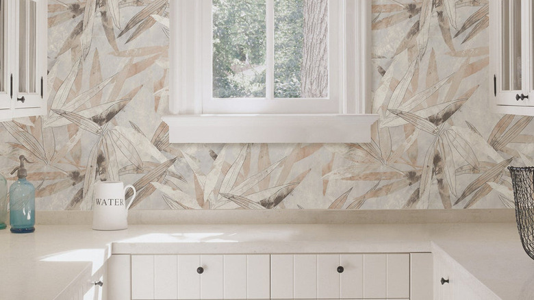 A neutral tropical wallpaper backsplash.