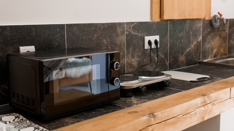 Microwave and hot plate serving as a temporary kitchen
