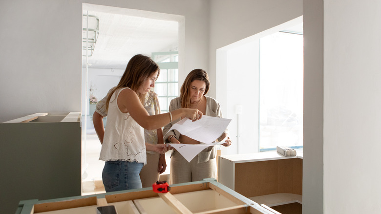 Homeowners looking at renovation plans