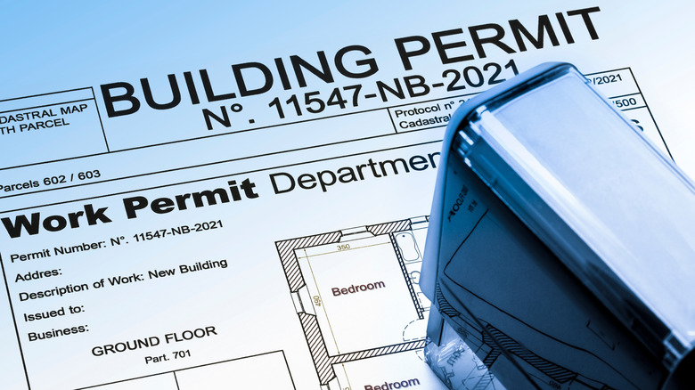 Work permit document with stamper by it