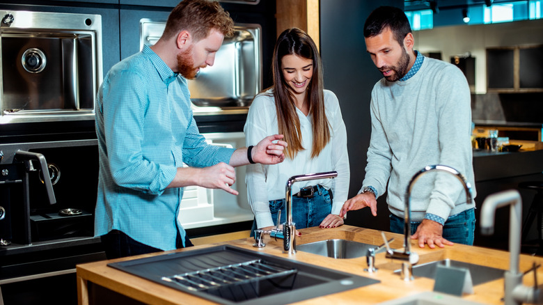 Shoppers in a showroom looking at kitchen options