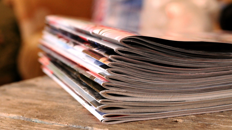 Old magazines stacked on a table