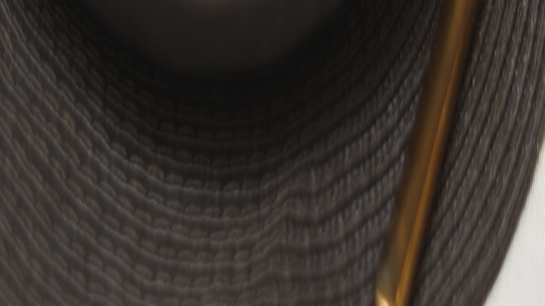 Place setting with gray napkin in gold reindeer napkin ring