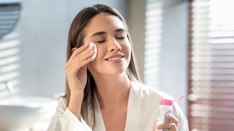 Woman using a cotton round