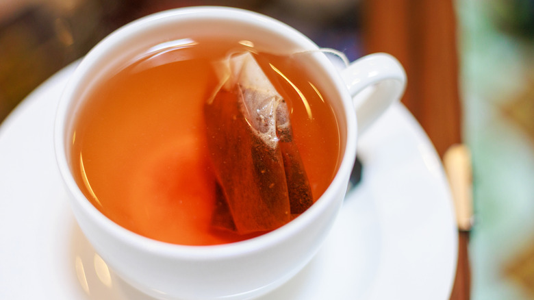 A cup of tea with a tea bag in it