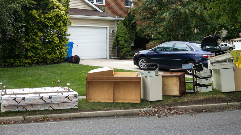 Furniture by the curb in a neighborhood