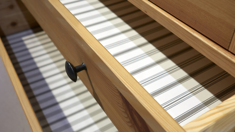 Two empty open drawers with shelf liners