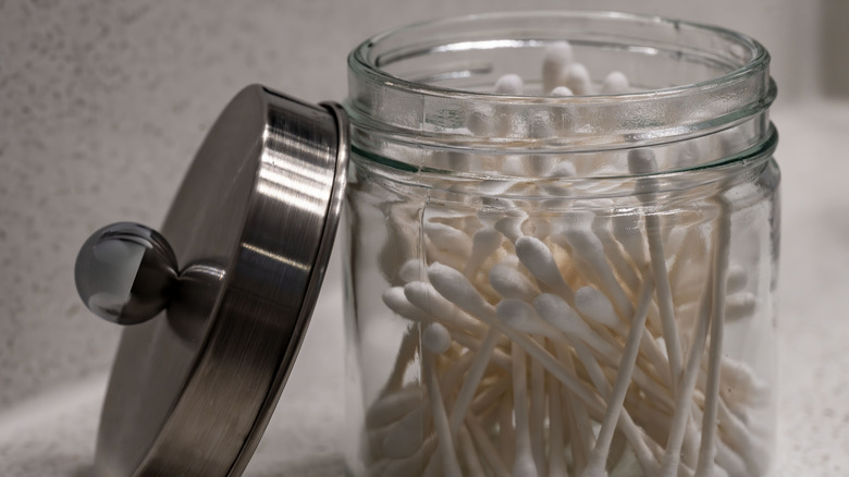 Glass container of Q-tips with silver lid