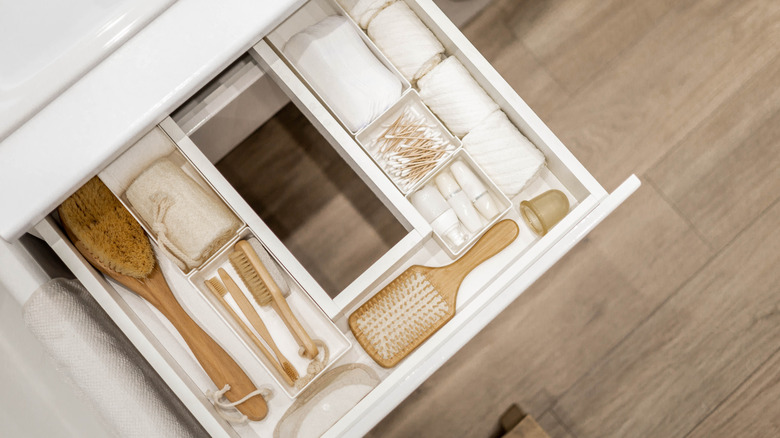 Bathroom drawer with brushes, towels and Q-tips