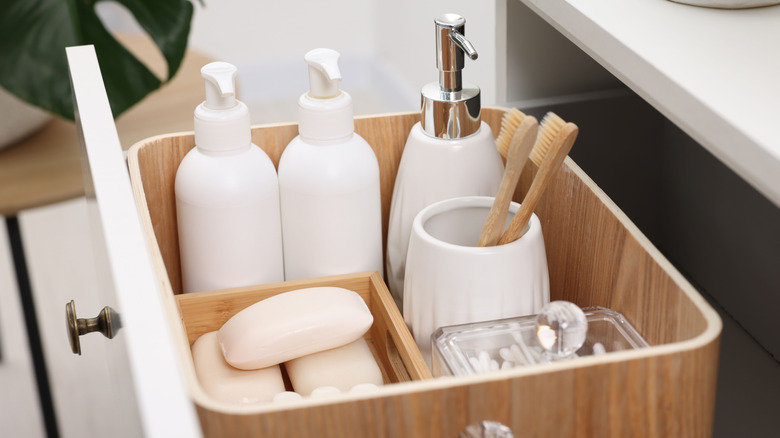 Open bathroom drawer with caddy inside
