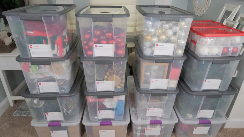 Stacks of labeled Christmas storage bins