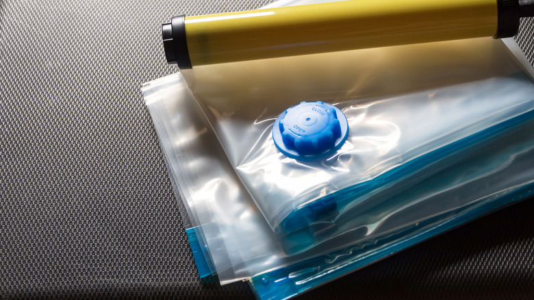 Stack of vacuum seal bags with a pump