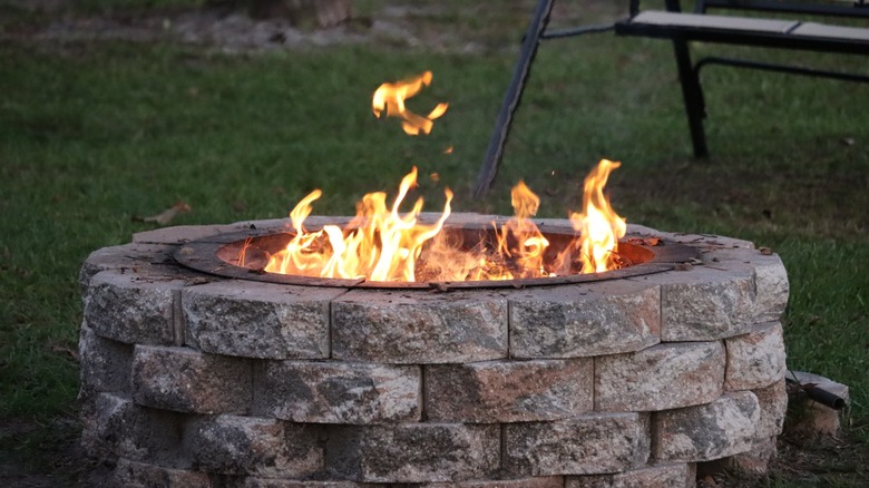 A fire pit in a backyard.