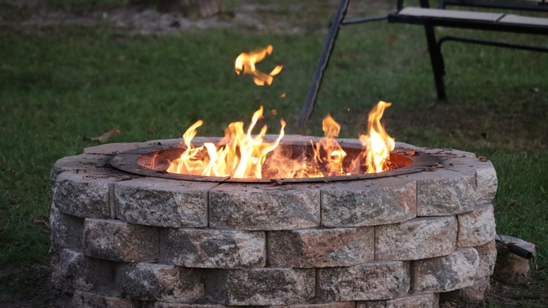 A fire pit in a backyard.