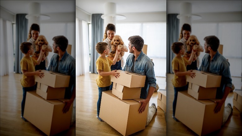 Family with boxes and dog 