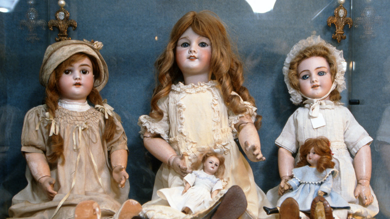 Antique dolls in a glass case