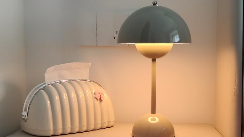 CYGL lamp on table next to decorative tissue holder