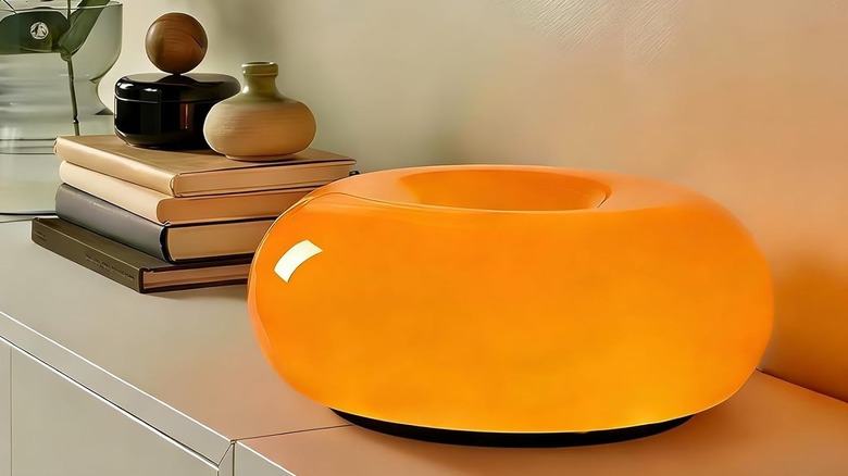 MIXL table lamp on cabinet next to books and decor